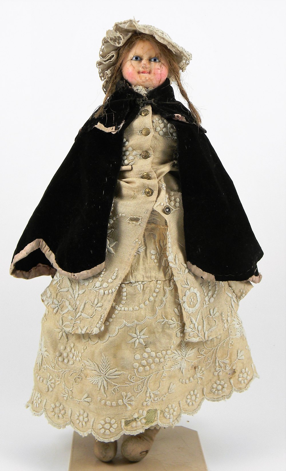 ‘Mad Alice’ wax over composition shoulder head doll, English circa 1840, with pale blue glass