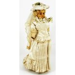 Wax over composition shoulder head bride, German circa 1860, with blue glass eyes, painted mouth and