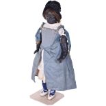 Very rare black poured wax shoulder head doll, English circa 1870, the turned head with brown