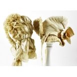 Two Satin Silk Babies Bonnets, circa 1875, larger bonnet with rows of frills and silk tulle lace,