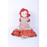 A wax over composition Pumpkin shoulder head doll, German circa 1860, with fixed glass pupil-less