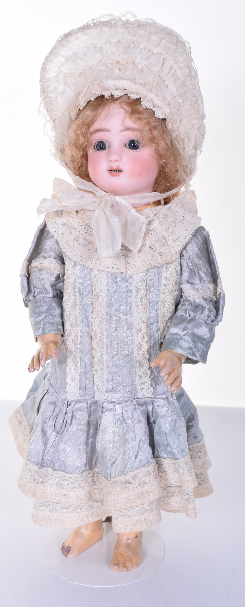 Steiner C bisque head Bebe, circa 1890, with blue glass lever-eyes, shaded lids and feathered