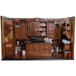 : A large and impressive wooden Pharmacy Room Set, German circa 1900, with painted ochre interior