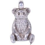A Crisford & Norris Sterling Silver Teddy Bear Charm, early 20th century, in the form of a seated