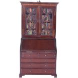 A finely made miniature Georgian style mahogany slant front Secretaire Bookcase, English probably