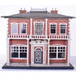 A Lines Brothers Grand Pillared Dolls house, English circa 1890, the red brick effect printed