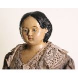 A large papier-mache Greiner shoulder head doll, American circa 1865, with painted blue eyes,