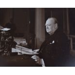 Outstanding Photograph of Winston Churchill C.1945 at his desk, nicely framed and glazed c.50cms x
