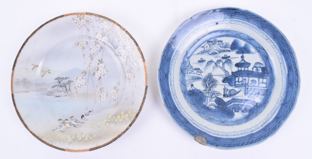 Two Chinese / Japanese Porcelain Plates, one in blue and white glaze with buildings and water scenes