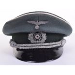 WW2 German Infantry Officers Peaked Cap, of green cloth body with white piping to the crown and