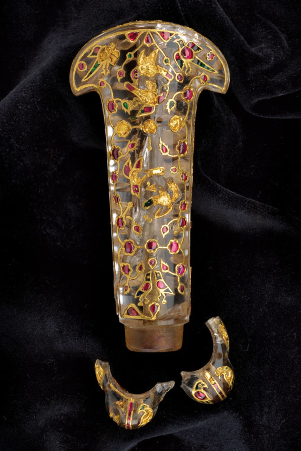 A highly important rock crystal dagger hilt decorated with rubies, emeralds and gold