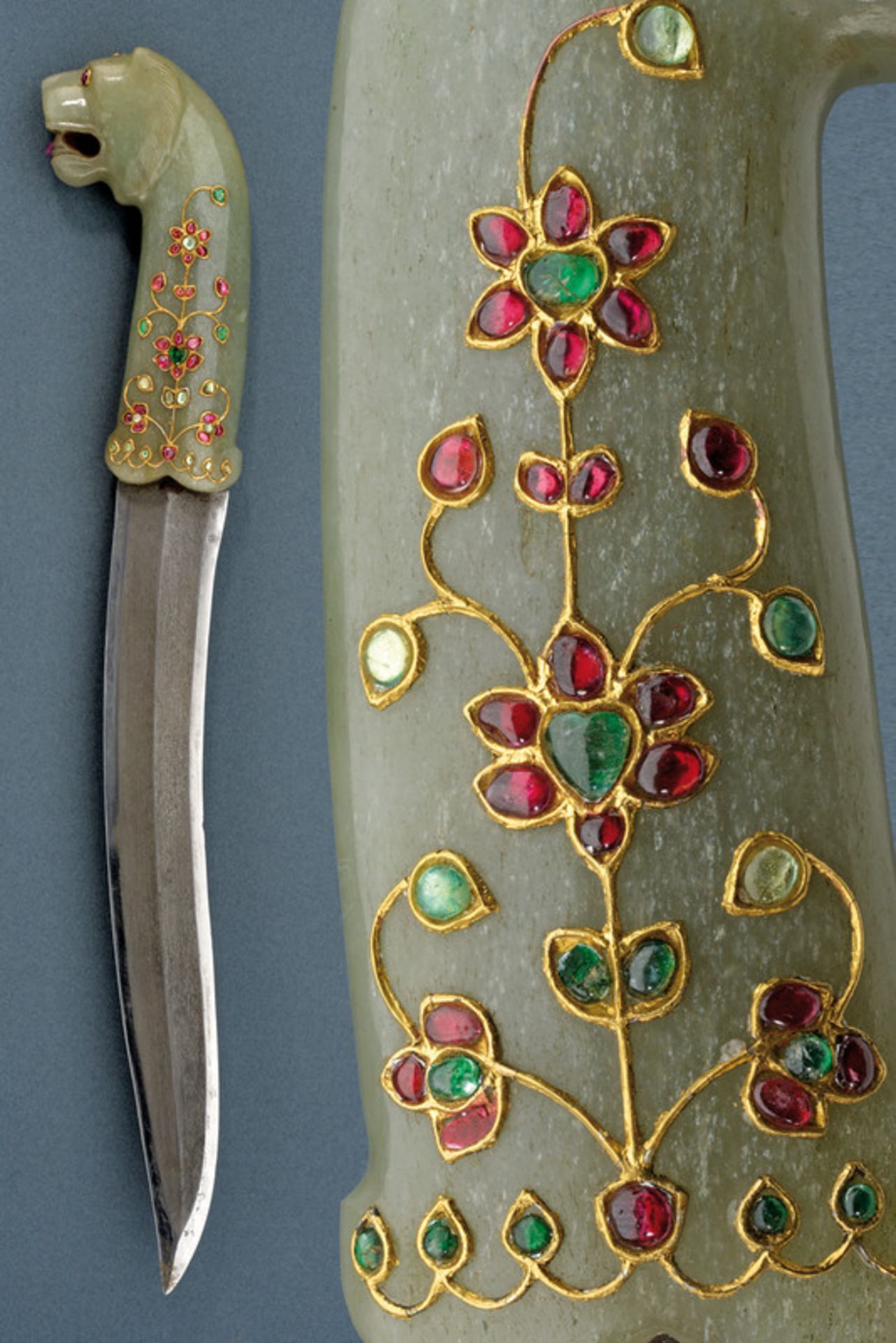 A jade hilted dagger decorated with stones and gold