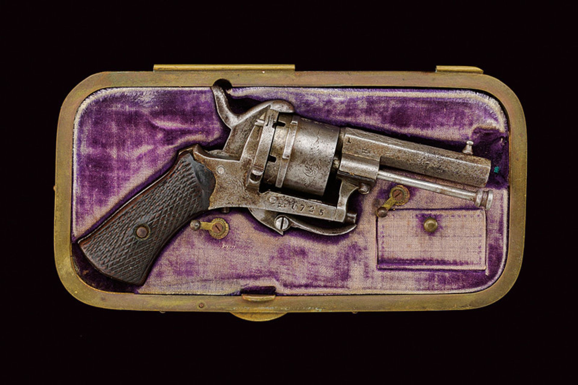 A cased pin fire revolver