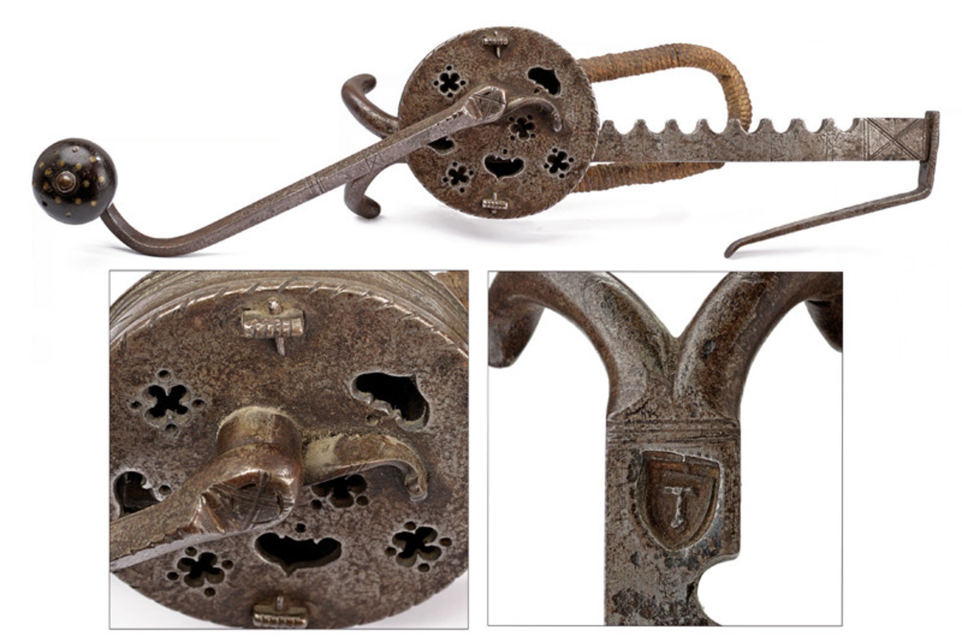 A crossbow jack dating: 17th Century provenance: Germany Round, iron box containing a toothed wheel,