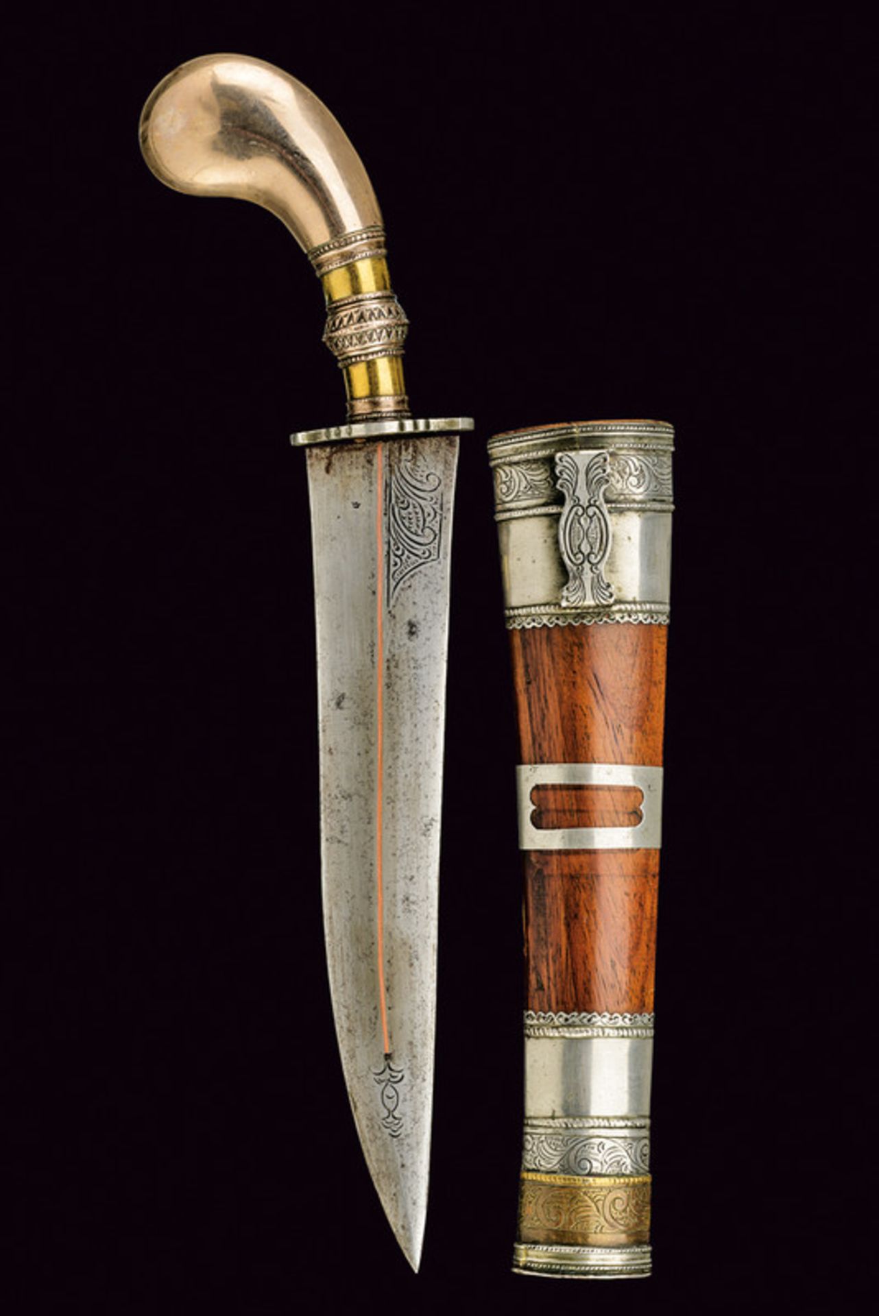 A dagger dating: second quarter of the 20th Century provenance: Indonesia Slightly-curved, single-