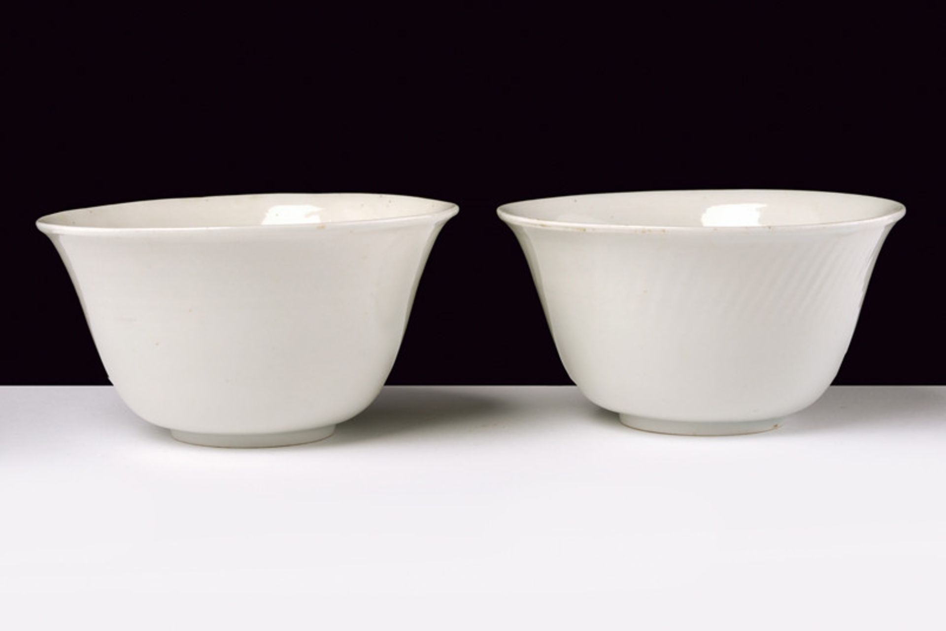 An exceptional pair of blanc-de-Chine porcelain cups with secret decoration dating: Shunzhi (1644-