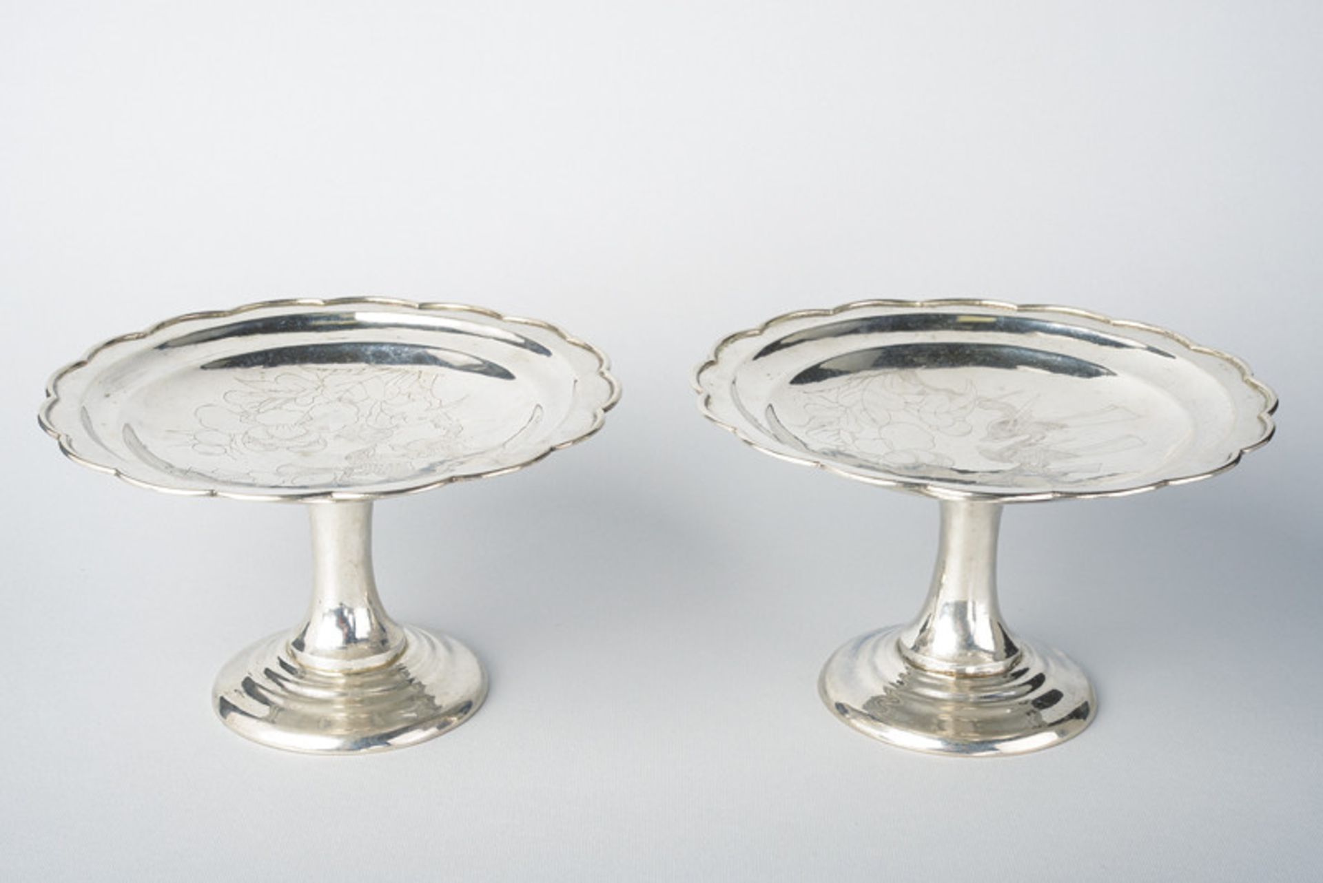 A fine pair of silver high footed bowls dating: 19th Century provenance: China On a wide base, the