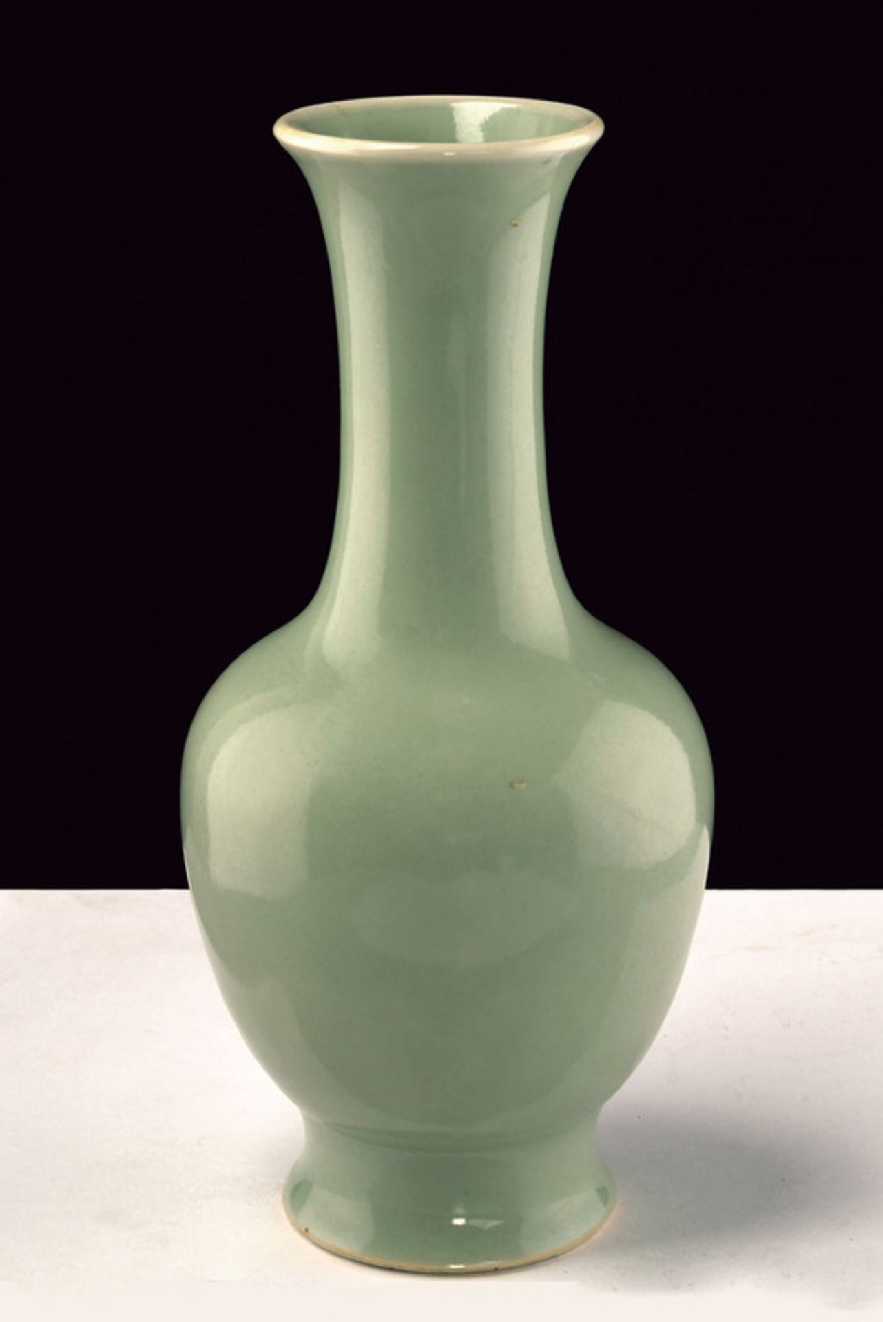 A celadon glazed porcelain baluster vase dating: late 19th Century provenance: China Globular