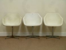 Three 'Robin Day' plastic designer chairs on chromed four spoke base