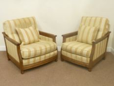 Two ash Ercol 'begére easy chair' armchairs with upholstered sides in golden dawn and matching