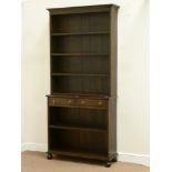 Early 20th century oak two tier bookcase fitted with four fixed shelves and two drawers, W100cm,