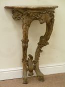 19th century heavily carved oak console table, decorated with foliage, central shell motif,
