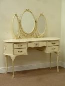 Cream and gilt kidney shaped dressing table fitted with triple mirror back and five drawers, W132cm,