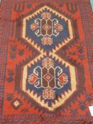 Persian Balochi red and blue ground rug,