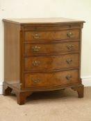 Reproduction figured walnut serpentine four drawer chest with brushing slide, fluted canted corners,
