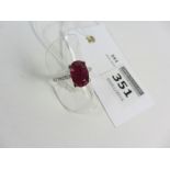 Natural oval ruby and diamond ring hallmarked 18ct (ruby approx 1 carat)