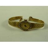 Ladies hallmarked 9ct gold bracelet wristwatch with diamond bezel