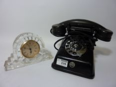 Vintage rotary dial telephone and a Waterford cut glass mantel clock