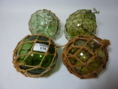 Four netted green decorative fishing buoys/floats