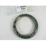 Early 20th century jade bangle with white metal decoration