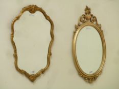 Shaped mirror in gilt frame (74cm x 46cm),