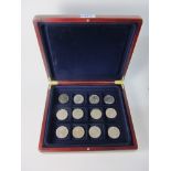 Twelve QEII five pound commemorative coins in one box