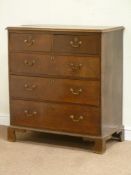 George III oak chest fitted with two short and three long drawers, raised on bracket feet,