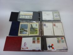 Album of GB commemorative First Day Covers with matching mint stamps and two other albums of FDCs (