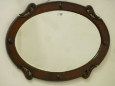 1930s oval oak framed wall mirror, W87cm,