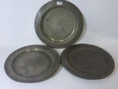 Three 18th century pewter chargers D38cm