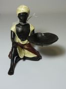 Cold painted bronze figure of a field worker,