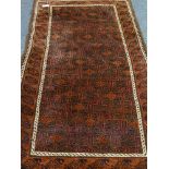 Afghan Beluch tribal red ground rug (108cm x 195cm),