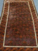 Afghan Beluch tribal red ground rug (108cm x 195cm),