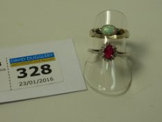 Ruby and diamond cluster ring stamped 925 and a ring set with an opal stamped sterling