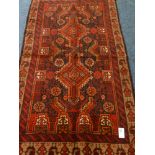 Persian Baluchi red ground rug,