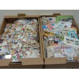 Large quantity of mint and used loose stamps in two boxes