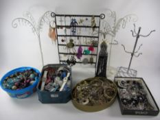 Costume jewellery in four boxes and five stands