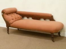 Edwardian walnut chaise lounge raised on turned legs, with carved detail,