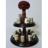 Collection of fifteen Royal Crown Derby thimbles on turned wood display stand H20cm