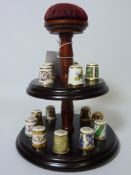 Collection of fifteen Royal Crown Derby thimbles on turned wood display stand H20cm